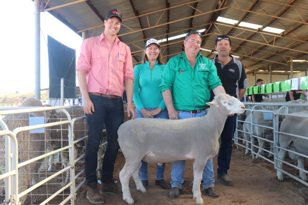Tom Page (left), Elders Geraldton, Tipperary stud principals Kristy and Randall Levett and top-priced Poll Dorset buyer Paul Broockmann, Boyup Brook, with the $2100 ram.