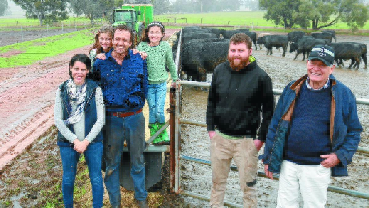 Tim (left) and Natalie Nixon at the Nixon Bros family feedlot with their daughters Bronte and Abby, feedlot manager Eamon McGee and Tims father Graham.