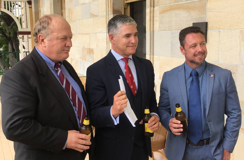 KAP's Shane Knuth, Rob Katter and Nick Dametto prepare to toast the success of the Private Members Bill.
