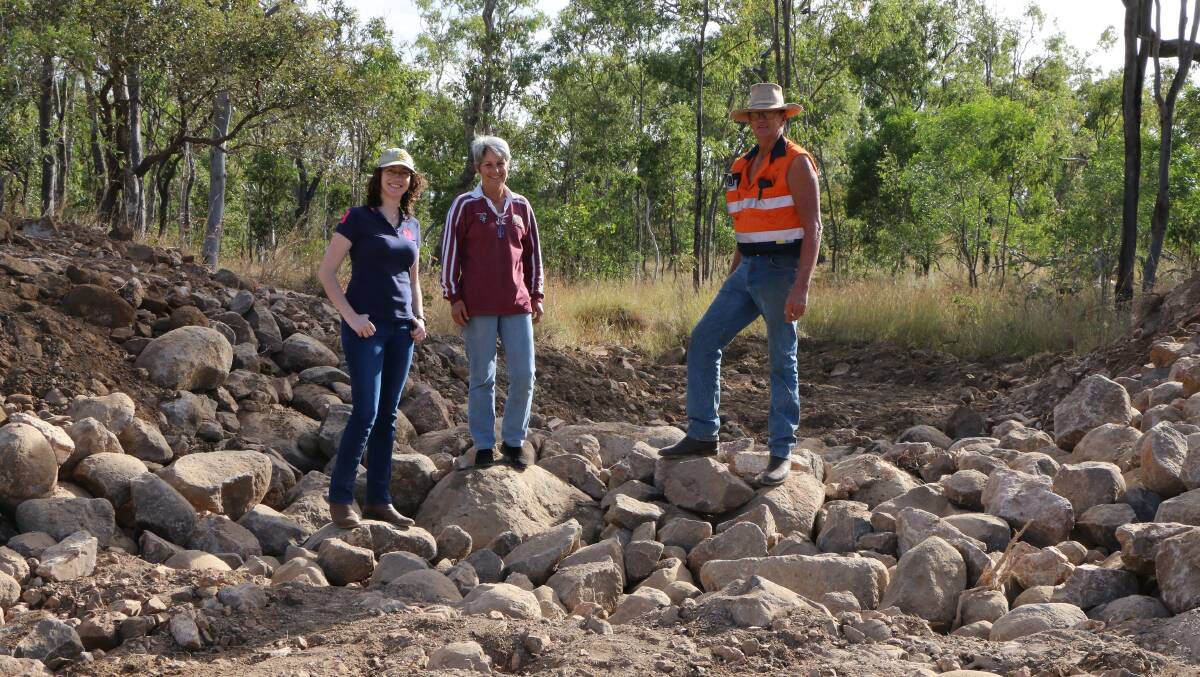 Kate and Peter Waddell and daughter Ellen Golebiowski, left, survey earthworks to reduce erosion on Woodleigh Station.