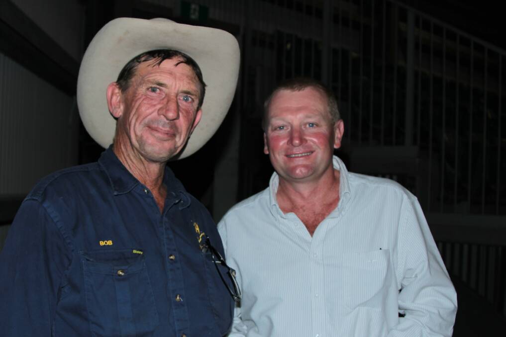 Bob Hicks, pictured with Blair Knuth, at the 2015 Charters Towers meeting protesting the defence department's compulsory acquisition land plan.