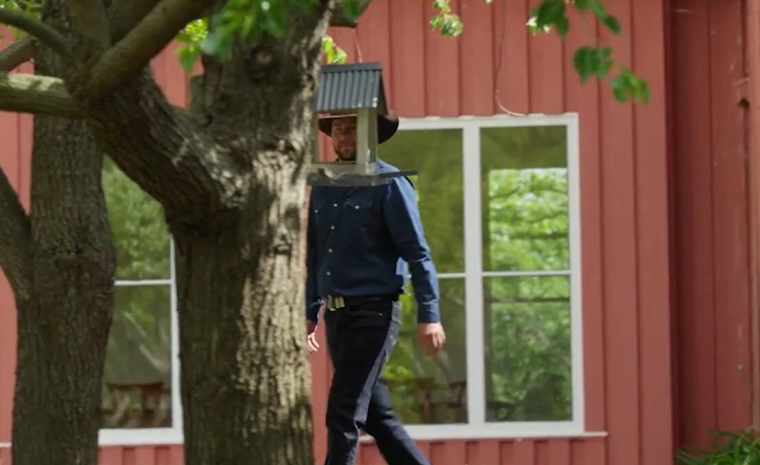 The mysterious newcomer, Farmer Todd, strides into view. He has his work cut out for him trying to lure a lady while wearing a bird feeder on his head. Picture supplied