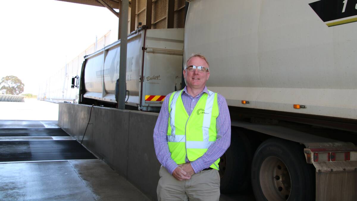 CBH project delivery general manager Andrew Porter with a load of canola being tipped at the Kwinana port