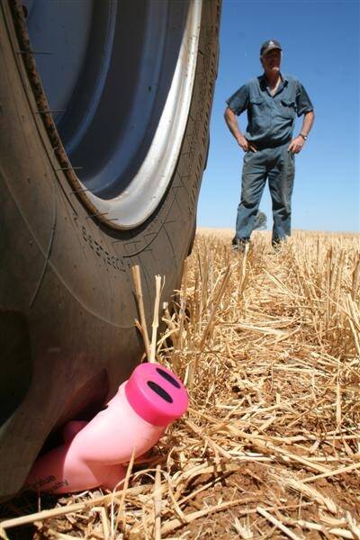 Newdegate farmer Bill Lloyd shows what he thinks of the piggy bank promotion. Mr Lloyd said he was furious at the timing of the "small gift" from CBH Grain and it couldn't have come at a worse time for so many of the growers who wouldn't even get a crop this year.