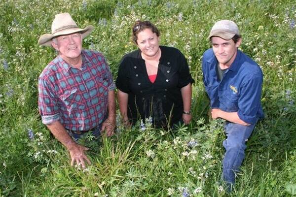 Craig Forsyth (left), with his daughter Brooke and son Nathan in a perennial grass paddock.