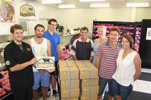 The Beef Shop manager and butcher Kurt van Oossanen (left), hands over the beef packs to Rohan Marriott, Corrigin, Tom Muir, Lake Muir, John and Anne Marshall, Cowaramup and Geoff and Jenny O'Brien, Mullewa.