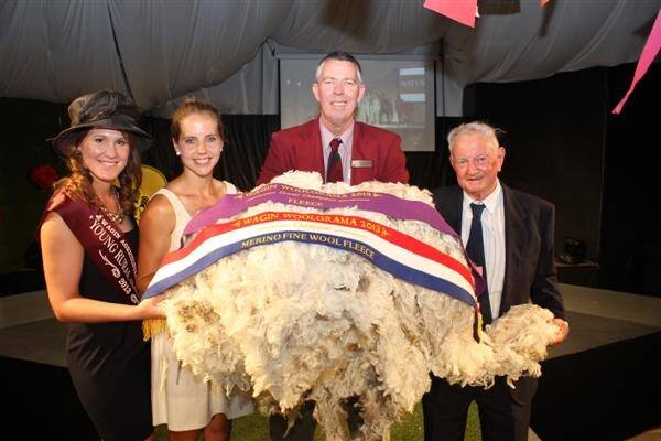 Young Rural Ambassador of the Year Clare Ward (left), Hockeyroo Ashleigh Nelson, who opened the show, Woolorama president Murray Gell and Wagin Woolorama patron Maurie Becker with the supreme champion fleece of Woolorama exhibited by the Seymour Park Poll Merino stud, Highbury.