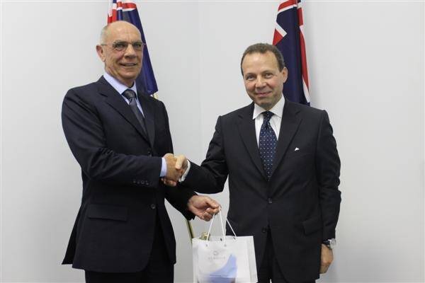 Parliamentary Secretary to the Treasurer Jim Chown accepts a gift from Egyptian Ambassador to Australia Hassan El-laithy.