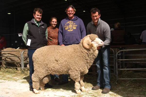 Pictured with the East Strathglen Merino ram which topped the sale at $10,500, were Landmark Breeding representative Mitchell Crosby (left), buyers Alanna and Jason Kanny, Wagga Wagga station, Walkaway and East Strathglen studmaster Rohan Sprigg.