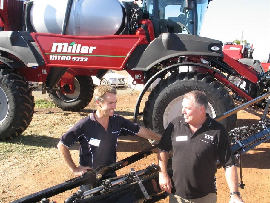 McIntosh & Son Kulin salesman Duncan Murdoch (left) and Barry West, Kulin, check out the Miller Nitro self-propelled boomsprayer recently bought by Barry.