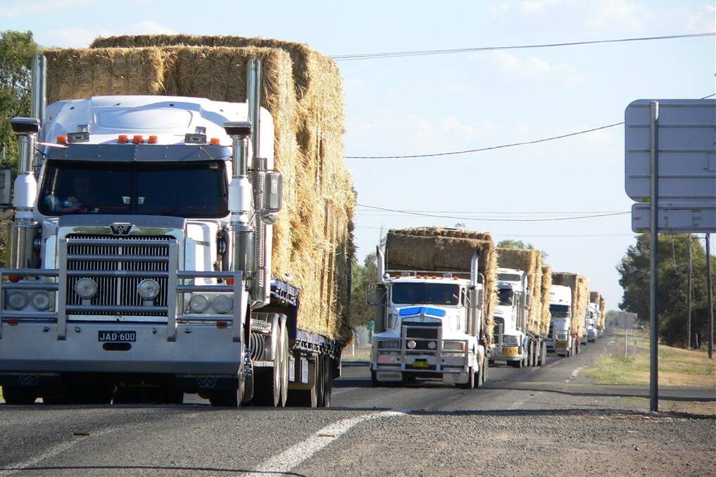 Semi-trailers loaded with hay on their way to Bourke in the Burrumbuttock to Bourke hay run in New South Wales in early February. Brendan Farrell, who was instrumental in organising the hay run has been assisting Esperance farmers Anne Bell and Sam Starcevich in their hay drive from WA.