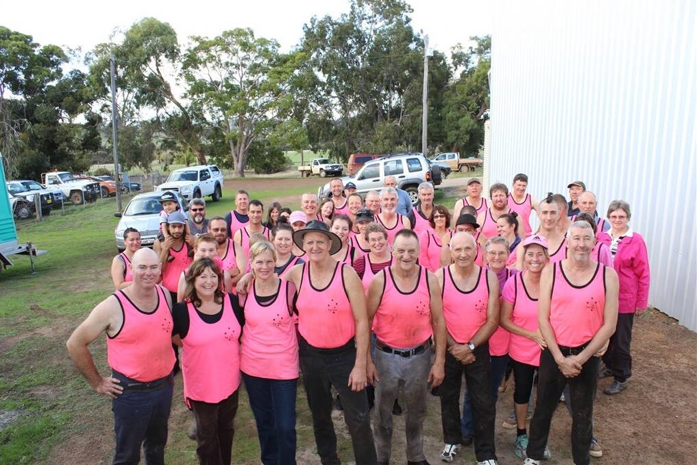 A large crowd rolled up to the Abbott family's shearing shed, proudly wearing their pink singlets in support. The charity pink shearing day was organised by Capercup stud principal Stephen Abbott, (front left) and his partner Anne Wright in conjunction with Kerry and Darryl Featherstone.