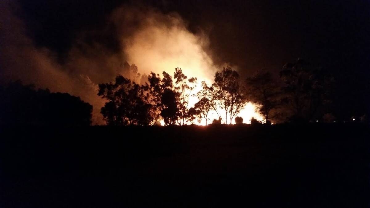 The fire jumping Somers road, towards the freeway on Wednesday night. Photo courtesy of Courtney Waller, Hamel resident.