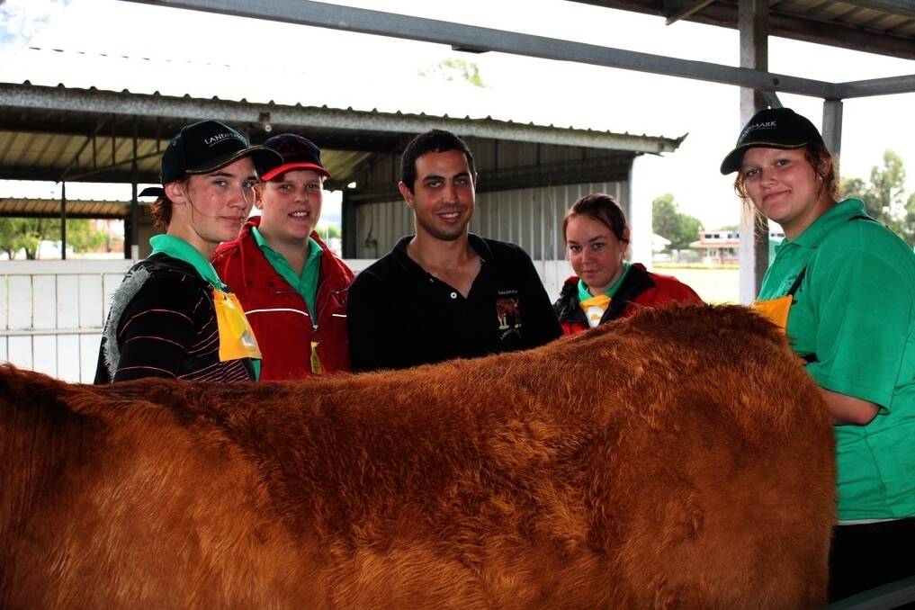 Michael Mamo, centre, as president of the WA Youth Cattle Handlers&#39; Camp with students. He now runs five businesses including three cattle studs.