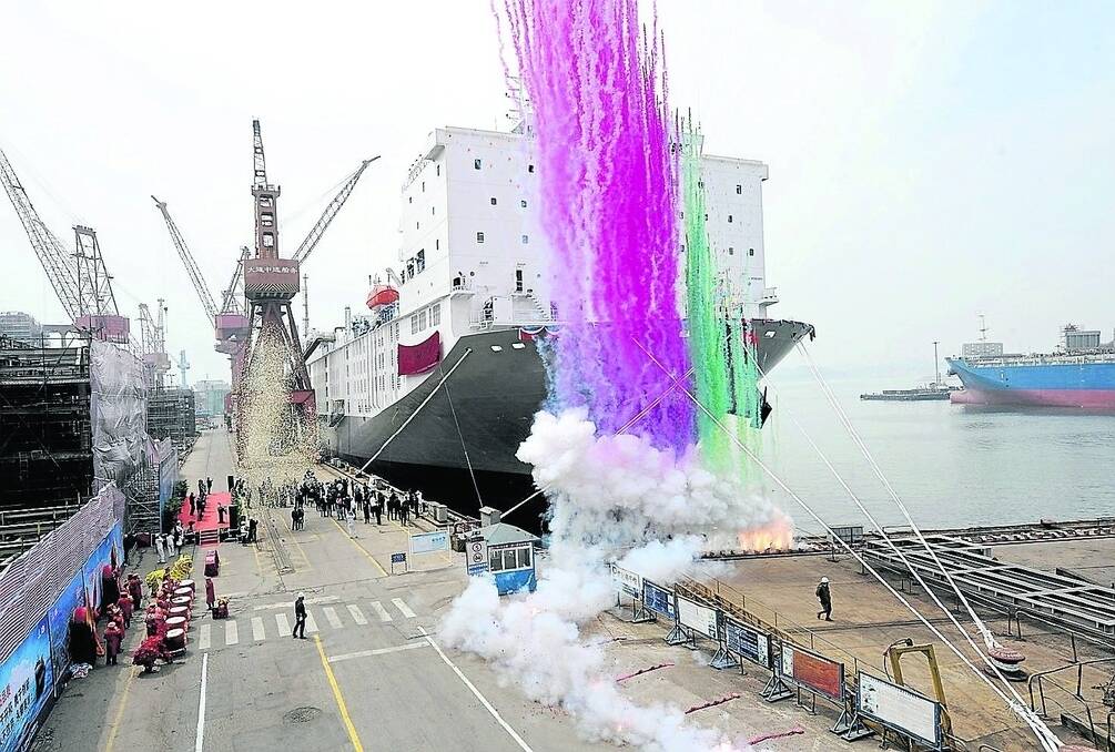 Fireworks herald the launch of the M/V Ocean Shearer in Dalian, China.