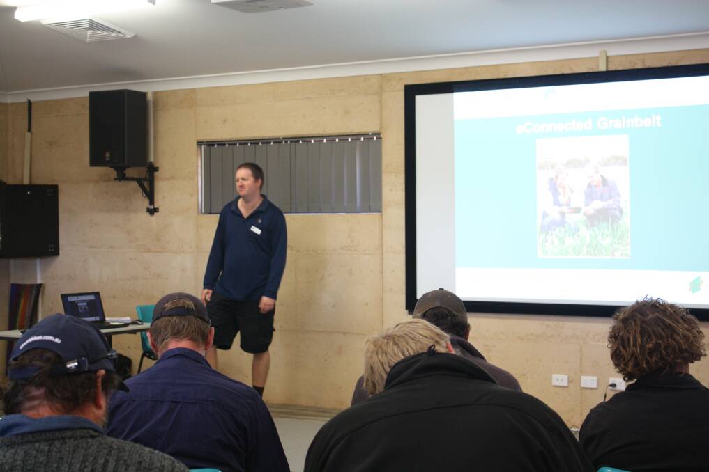 Department of Agriculture and Food project officer Chad Reynolds talks about the department's new eConnected Grainbelt Project to farmers attending the Yuna Farm Improvement Group's post emergent field day walk.