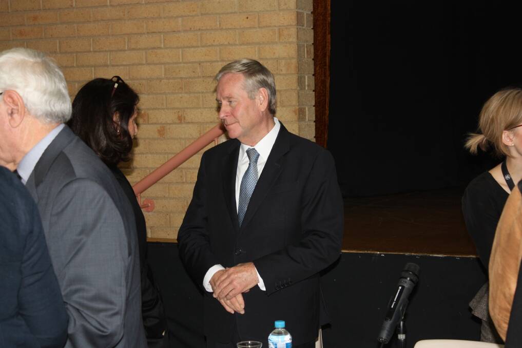 Premier Colin Barnett at the bushfire meeting in Harvey in June. He is being asked to protect WA's volunteer fire brigades.