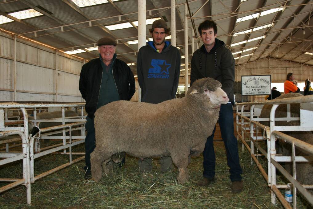 Lewisdale Corrigin stud consultant Jack Lewis (left) with Michael Sudholz who paid the equal top sale price of $3000 for a four tooth ram held by stud co-principal Luke Ledwith.
