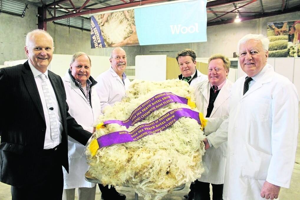 The McIlroy family, Glendawn Poll Merino stud, Pithara, exhibited the supreme fleece at this year&#39;s IGA Perth Royal Show. With the fleece are chief judge Tim Chapman (left), Primaries, chief steward Ian Henry, judges Graeme Luff, Primaries, Cameron Henry, Landmark, Tim Burgess, Elders and RAS councillor in charge of wool Ken Walker.