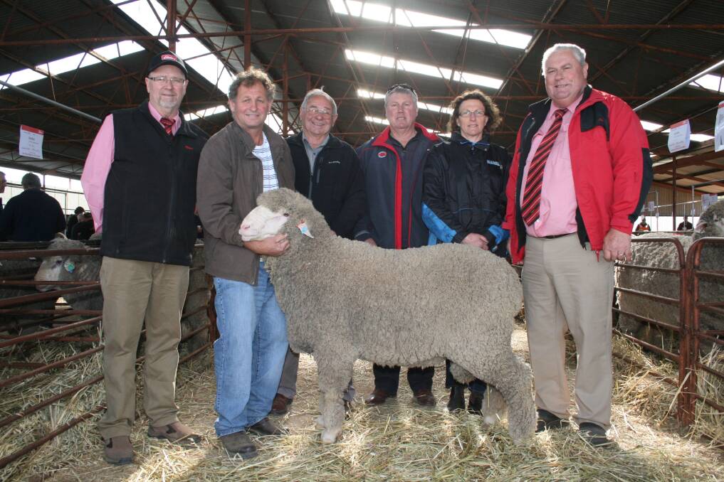 With the top-priced ram were Elders auctioneer Don Morgan (left), Brad and Don Eaton, Olinda stud, buyers Peter and Angela Panizza, Trevino stud and Olinda and Trevino stud classer Kevin Broad, Elders stud stock.