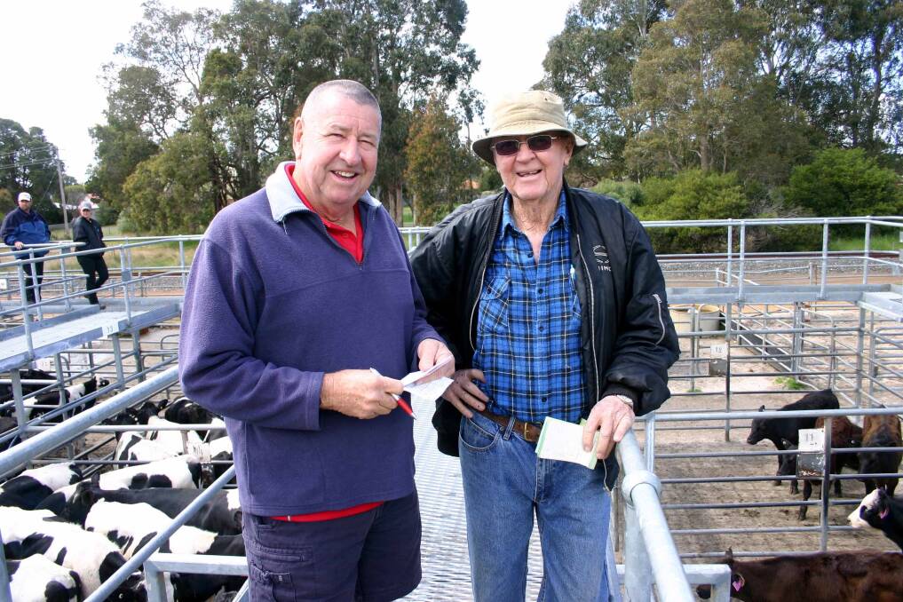 Terry Tarbottom (left) Elders Nannup, arranging buying action with client Keith Rogers, Nannup, who had to leave before the sale started.