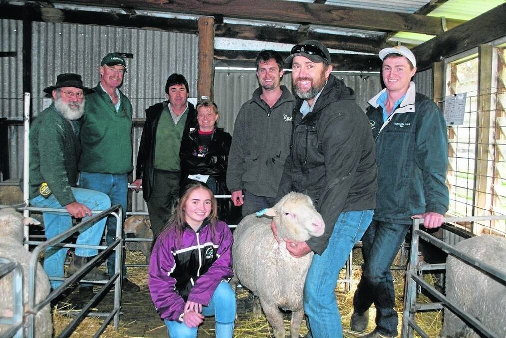 Joint top price buyer Anderson Dufty (left), Mt Barker, with Landmark auctioneer Charlie Staite, Ray and Kylie Williams, Mt Barker, Ashton Hood, Koojoneerup South and Amy and Jacob Sounness with their father Greg holding one of the three $1450 Dohnes rams at their Denvale Dohne on-property ram sale last week.