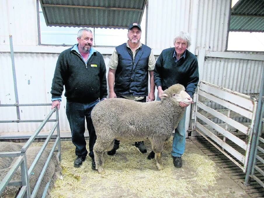 Dyson Jones auctioneer Andrew Kittow (left), buyer Carlo Varone, Hyden and Fern Park principal Kevin Pauley with the top-priced ram Mr Varone purchased for $1800.