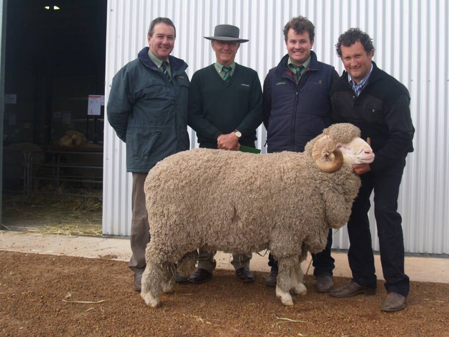 With the ram were Landmark stud and commercial sheep manager Tom Bowen (left), Landmark sale auctioneer Neil Brindley, Landmark Breeding Services representative Mitchell Crosby who bid on behalf of the Hedger family and East Strathglen co-studmaster Rohan Sprigg.