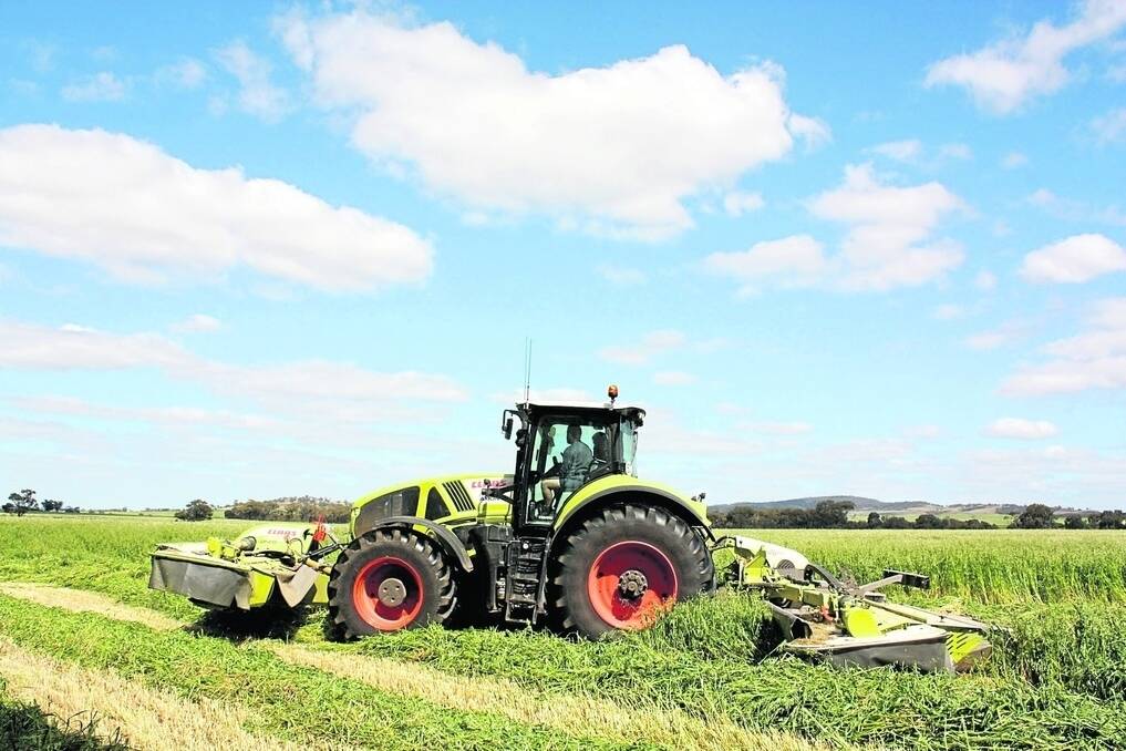 The CLAAS 930 tractor in action mowing oaten hay at York last week.
