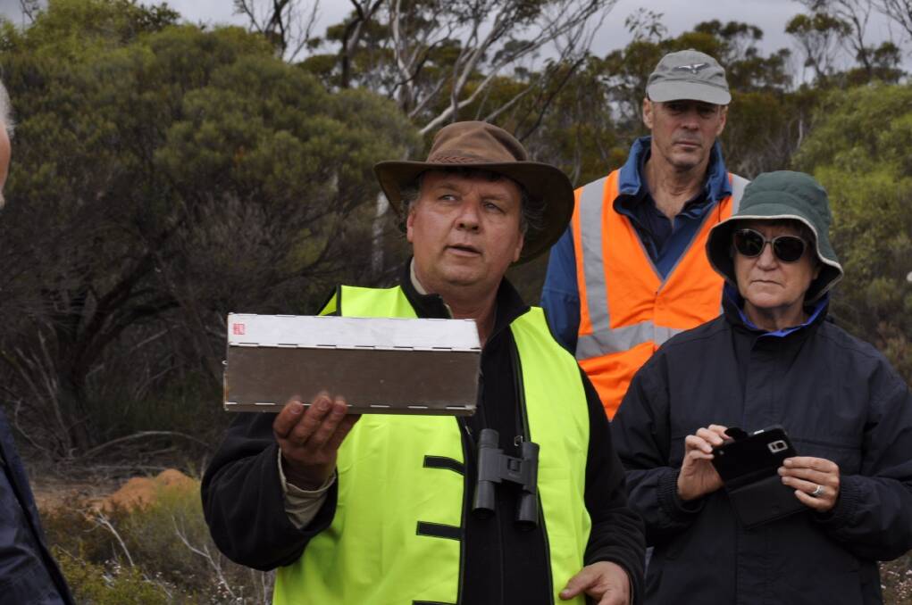 Wheatbelt NRM's Leigh Whisson (left) giving volunteers instructions on how to set traps to help identify native animals during the Tarin Rock Bioblitz.