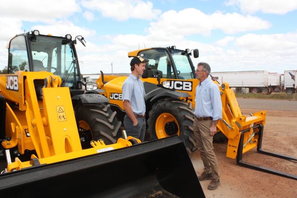 Ben Boekman (left) and DSATCO Mulch owner David Baljeu discuss the new JCB 541.70 telehandlers which have become the company's new year-round workhorses with an expected work rate of 800 hours a year.