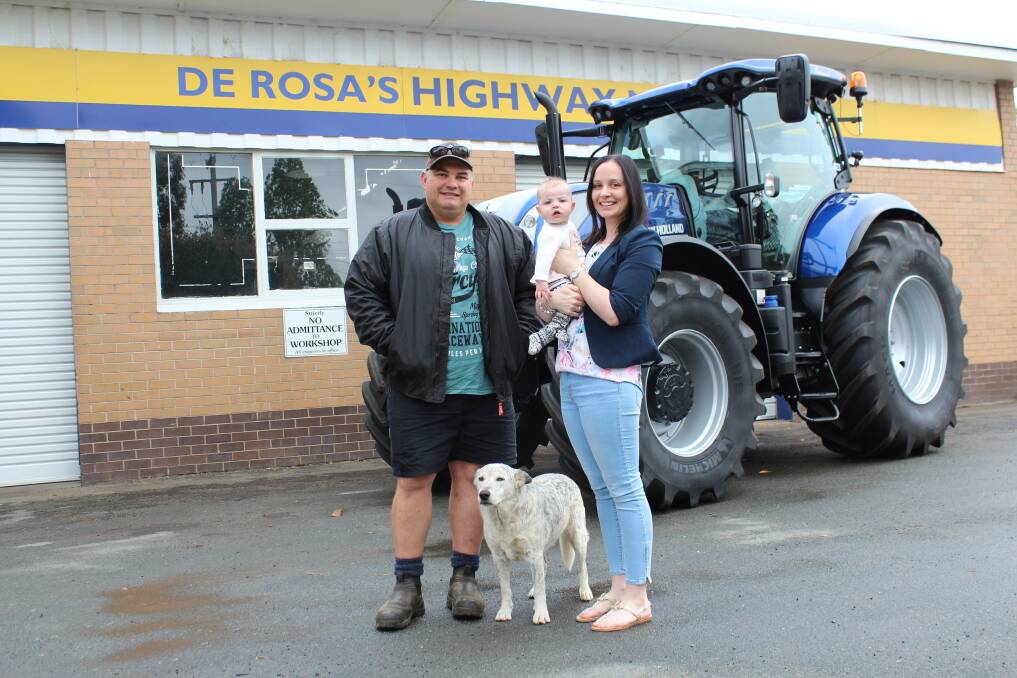 Jono Trigwell (left) with wife Jessica, daughter Hayley, six months, and dog Bear with thier new T7.245 Blue Power New Holland tractor.