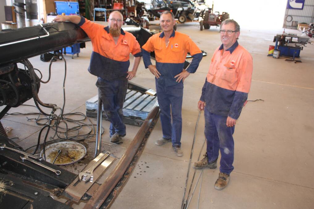  It was all go at Hutton and Northey's Merredin branch when Torque visited last week. Especially in the fabrication shed where the dealership continues to expand its fabrication business, particularly involving straightening bent fronts, such as this one being assessed by Brendan Anderson (left), Angelo Trunfio and Bernard Jefferies.