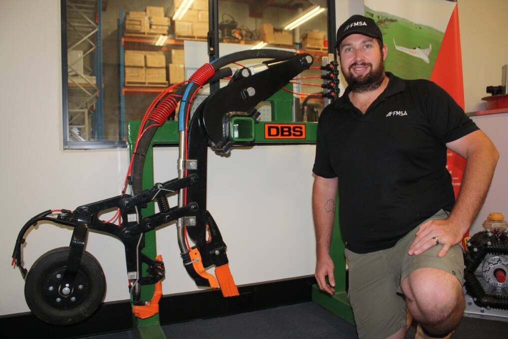 Former South Australian farmer and Furrow Management Systems part-owner Keiran Coffey shows how the company equips a seeding module with its furrow injection kit. "We really want to provide farmers with an easier pathway into a new world of precision farming," he said.