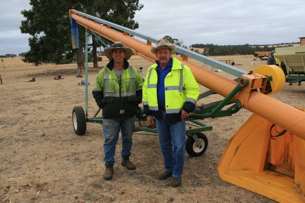 Having a look at an auger prior to the sale were Charles (left) and Ray Farmer, Badgingarra.