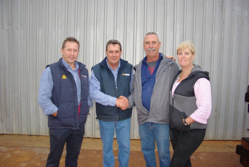It was smiles all round after Lacky (second from right) and Min's (right) clearing sale at Kale Kind. Pictured with the happy vendors are Primaries wool manager Greg Tillbrook and Primaries auctioneer Terry Zambonetti.