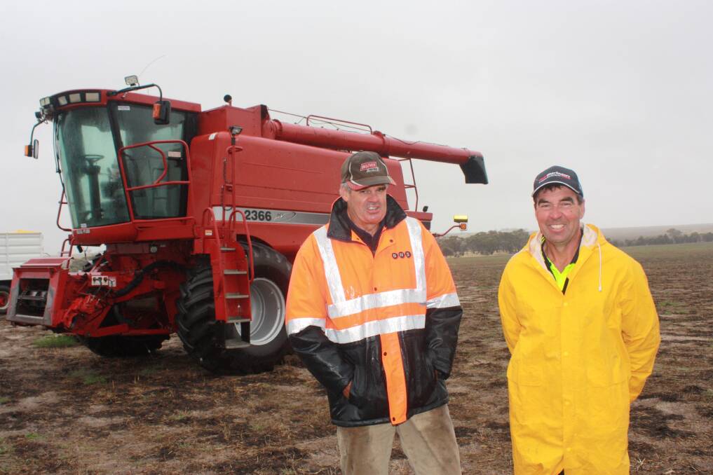 Jon Rick (left) and Robert Harris pictured with the Case IH 2366 header which was picked up by LG & F Hagboom for $28,000.