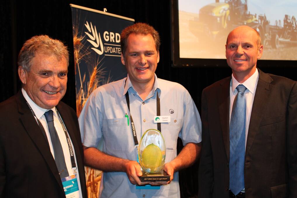 GRDC Western Regional Panel Chairman Peter Roberts (left) with the 2017 GRDC western region Seed of Light award winner Stephen Davies, of DAFWA, and GRDC chairman John Woods at the opening of the GRDC Grains Research Update in Perth this week.