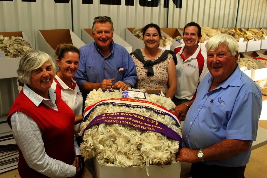 The Rintoul family, Auburn Valley stud, Williams, claimed their first supreme fleece award at Woolorama with this stylish ram&#39;s fleece. Sharing the joy were Ann Rintoul (left), Fiona Kirk representing sponsors Country Wide Insurance Brokers, Jeffrey Rintoul, Brooke Rintoul, Paul Shutz, Country Wide Insurance Brokers and Peter Rintoul.