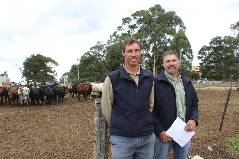 Checking out the cattle in the feedlot after the morning session of presentations were Eric Dobbe (left) and David Rogers from DAFWA.