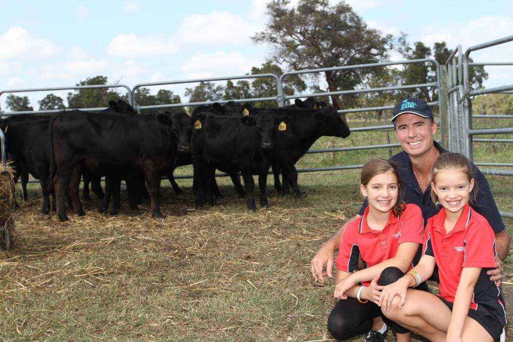 Farm Weekly's WA Angus Breeders Win 10 Angus heifers and Sydney Royal Easter Show package winner Stephen Beckwith with his daughters Mataya (10) and Lily (8) saw the safe arrival of their 10 Angus heifers at their new home at Beeramullah.