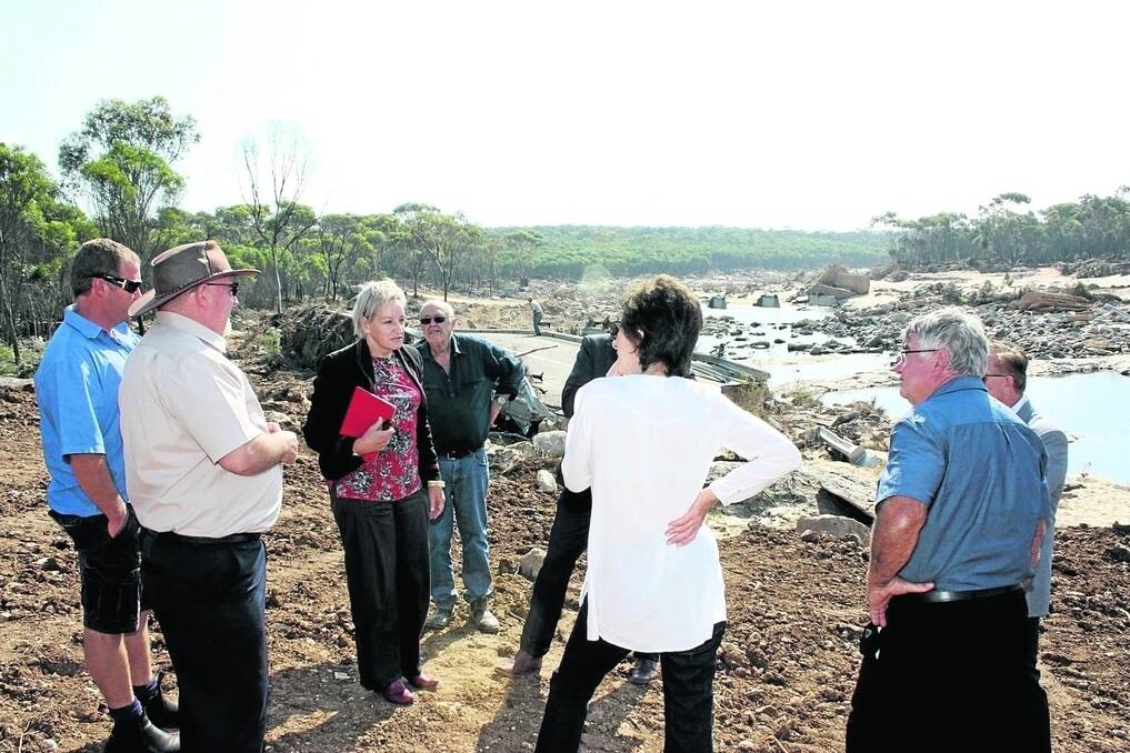 Agriculture Minister Alannah MacTiernan speaks with concerned residents of the Ravensthorpe and Newdegate communities, alongside the remnants of the Phillips River Crossing in Ravensthorpe.