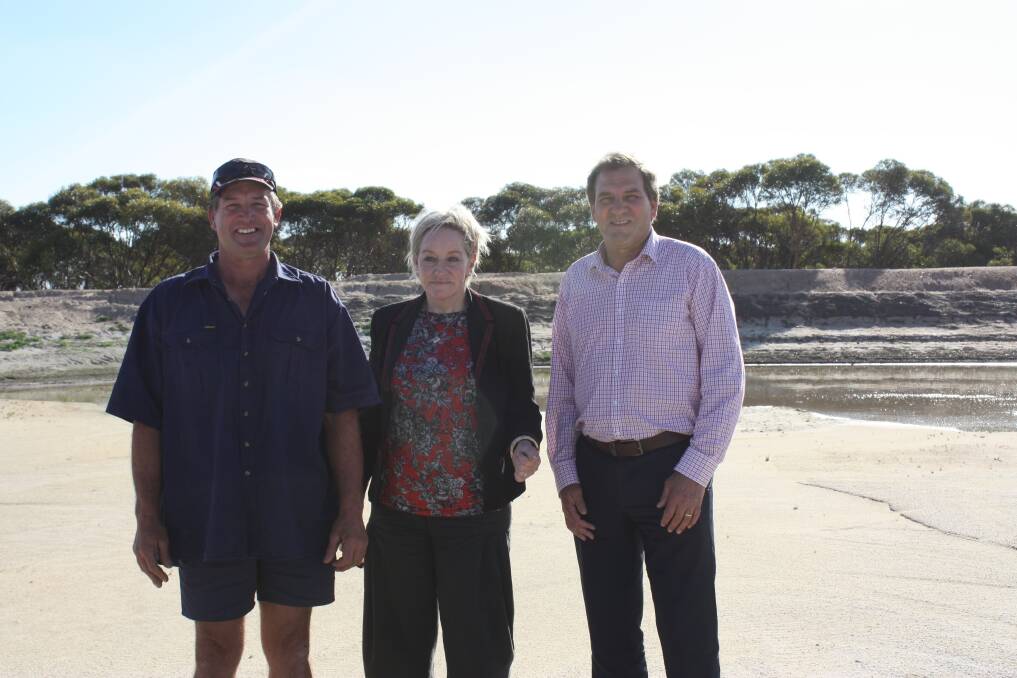 Dunn Rock farmer Darren Wiech (left), with Agriculture and Food Minister Alannah MacTiernan and her parliamentary secretary Darren West. The trio stand in front of Mr Wiech's key dam that has filled with silt.