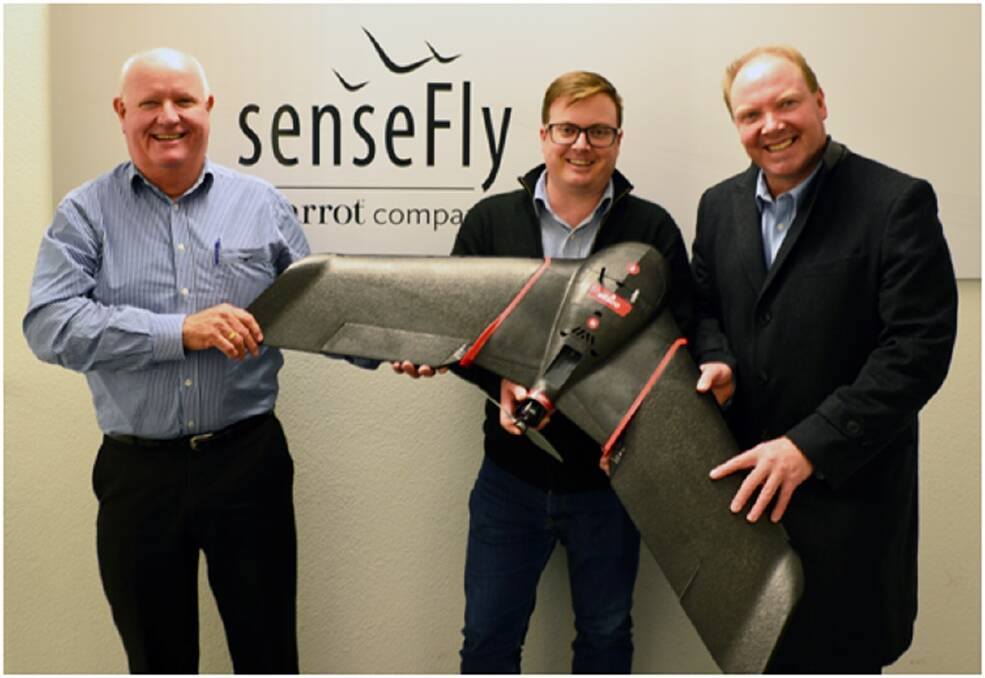 ARAG Australia CEO Kym Eldredge (left), senseFly sales director Brock Ryder and ARAG Australia national sales manager Paul Fischer hold the eBeeSQ fixed wing unmanned aerial vehicle.