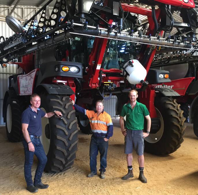 Bayer commercial sales representative Ian Cook (left), Marchagee grower Mick Callaghan and Landmark Coorow agronomist Andy Regan pictured discussing some of the latest developments in weed control in front of one of Mike's Miller Nitro self-propelled sprayers.