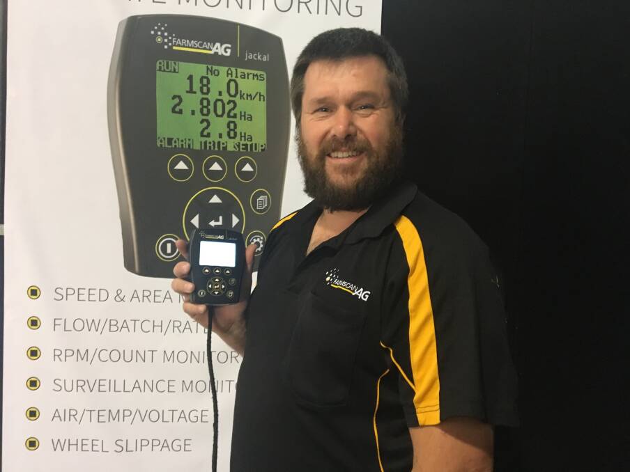 Farmscan Ag OEM manager Clark Croucher pictured with one of the company's latest Jackal multi-function monitors during the recent Wimmera Machinery Field Days at Horsham, Victoria.