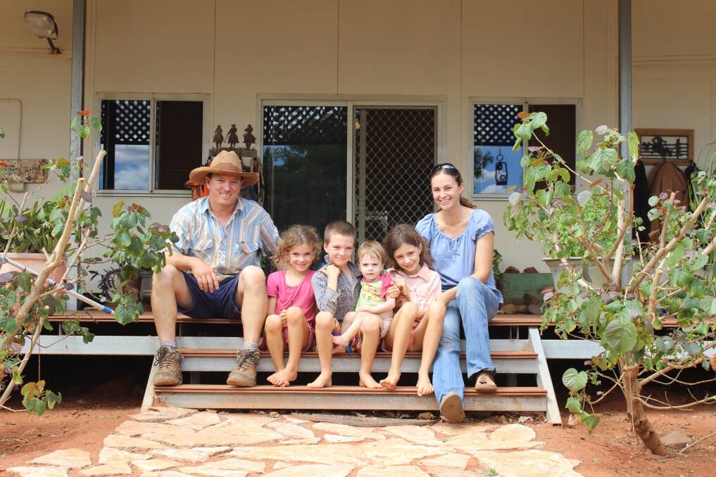 Rory (left) with Mia (5), Joey (7), Tom (1), Darcie (9) and Kristie de Pledge take a break from work at Koordarrie station.