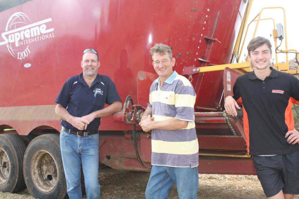 Bunbury Machinery branch manager Darren Pulford (left), discusses the performance of the Supreme 1200T feed mixer with Elgin Dairies director Darren Merritt and his son Chad.