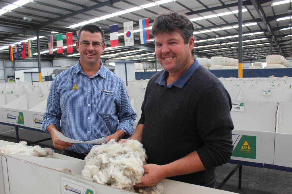 Primaries of WA broker Sean Gillespie (left) and Jeremy King, Rangeview stud, Darkan, inspecting the Rangeview clip which sold on Thursday last week for more than it ever has before.