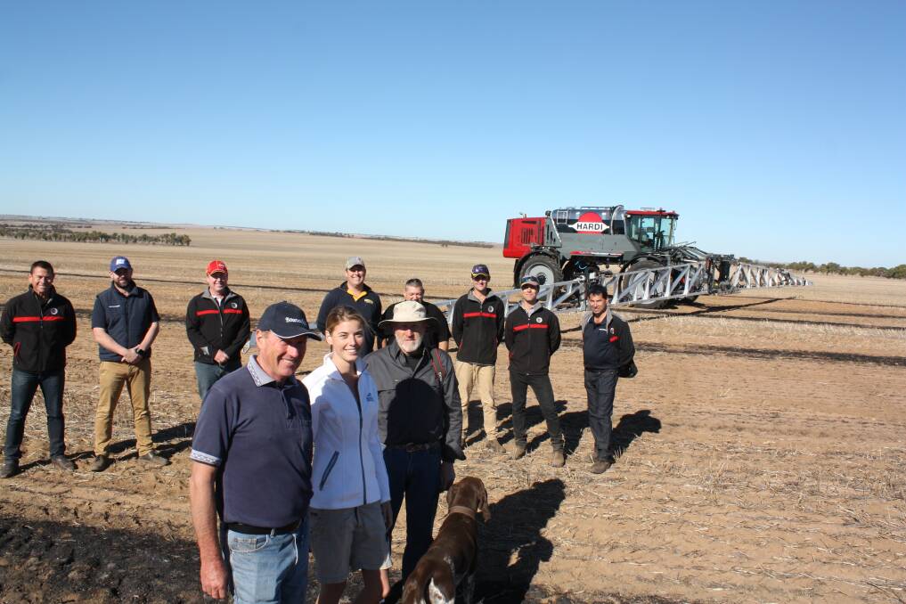 Wubin farmers Sam Southcott (left), his daughter Camille and brother Alan ready for spraying with their Hardi Rubicon 9000 self-propelled boomsprayer. In the background are Hardi and McIntosh & Son Moora representatives who attended the official handing over of the Rubicon to the Southcotts last week. It is the first Rubicon to be delivered in WA and McIntosh & Son already has a demonstration prog